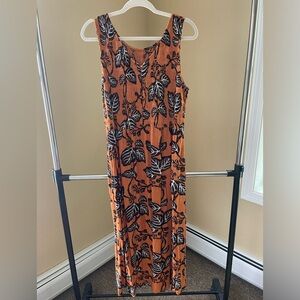 Long burnt orange and black dress with small buttons on front